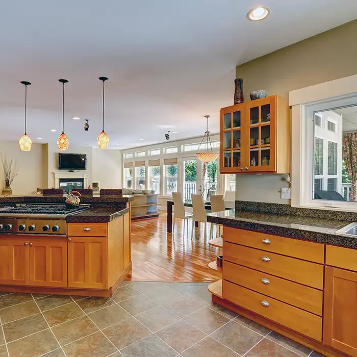 kitchen with tile flooring and living room with hardwood flooring